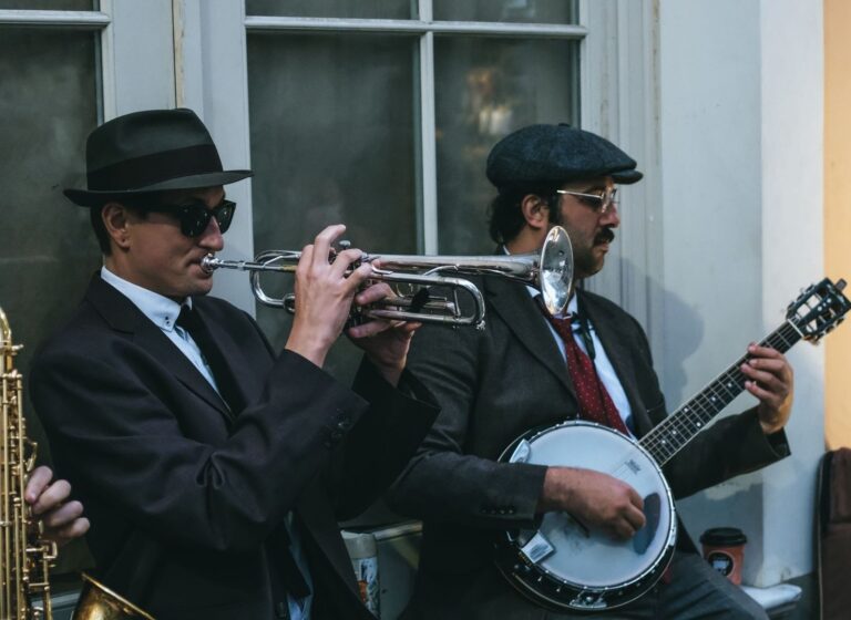 Two vintage-styled jazz musicians playing trumpet and banjo outdoors